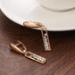 Boucles d'oreilles pendantes design rectangulaire, bijou en plaqué or rose 585 (14 carats) et en zircons naturels