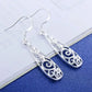 Boucles d'oreilles arabesques ajourées, bijou en plaqué argent