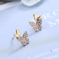 boucles d'oreilles papillons avec zircons mauves