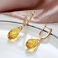 boucles d'oreilles avec cristal jaune et zircons blancs